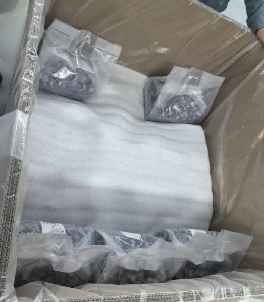 Close-up of an RFID non-metal-resistant tag affixed to the corner of a wooden pallet carrying semiconductor goods, enabling unique digital identification.  Photo 5