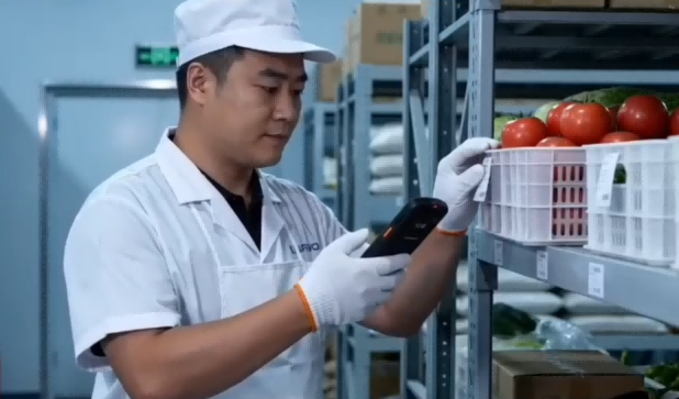 PDA Scanning of Food Labels Staff scanning food ingredient labels with a PDA for inventory and traceability